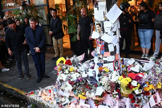 Geoff Payne stands next to tributes left outside the hotel where Liam Payne was found dead