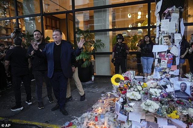 Geoff Payne waves to fans of his son Liam Payne as he visits a memorial outside the hotel where the One Direction star died