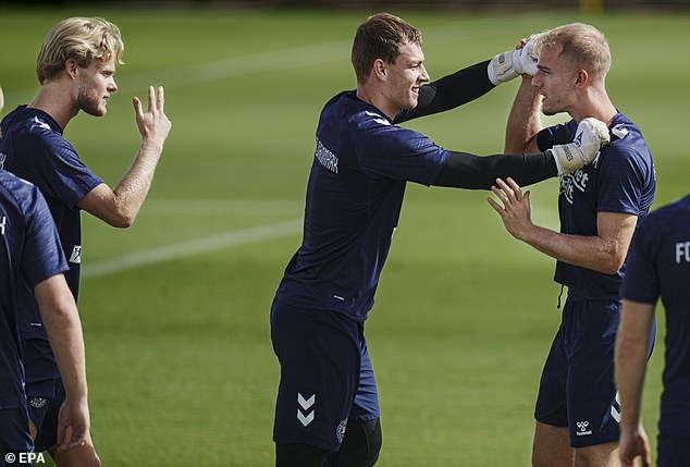 Mads Hermansen, center, revealed that Hojlund knocked his tooth out on a corner