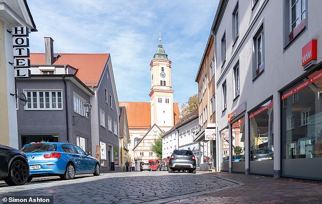 A view of a street in Krumbach shows the town's clock tower