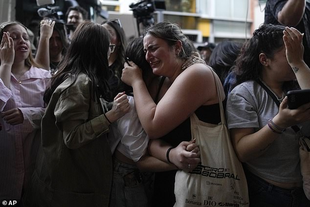 Fans of Liam Payne mourn outside the Casa Sur Hotel, where the British pop singer died on Wednesday