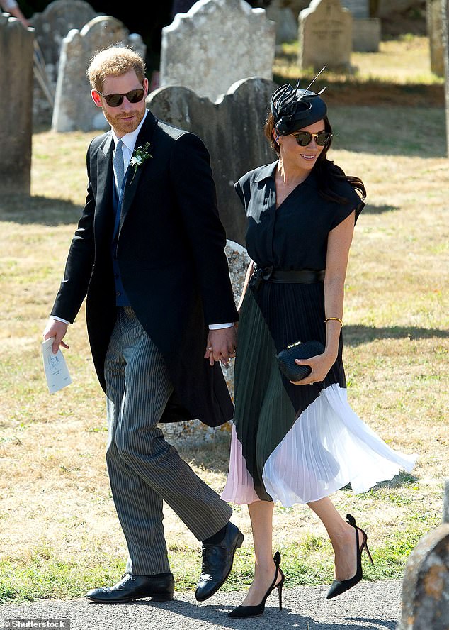 Meghan holds Prince Harry's hand during Daisy Jenks and Charlie van Straubenzee's wedding in 2018