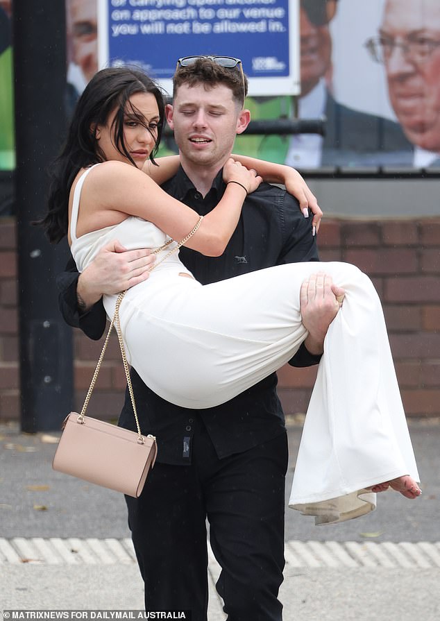 This racegoer looked as if she was being carried over the threshold of Royal Randwick on Saturday