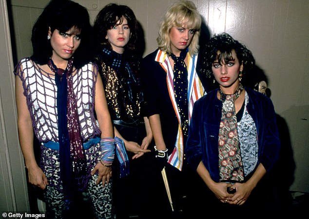 Hoffs' (L) famous band The Bangles was formed in 1981 when she met sisters Vicki (L) and Debbi Peterson (2nd from right); pictured with bassist Michael Steele (2nd from left)