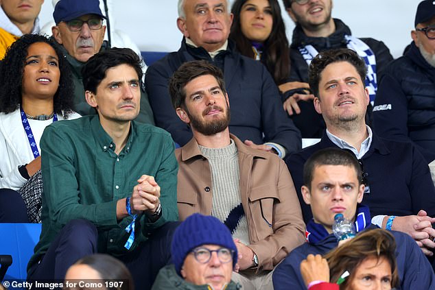 The movie star watched the match with concentration