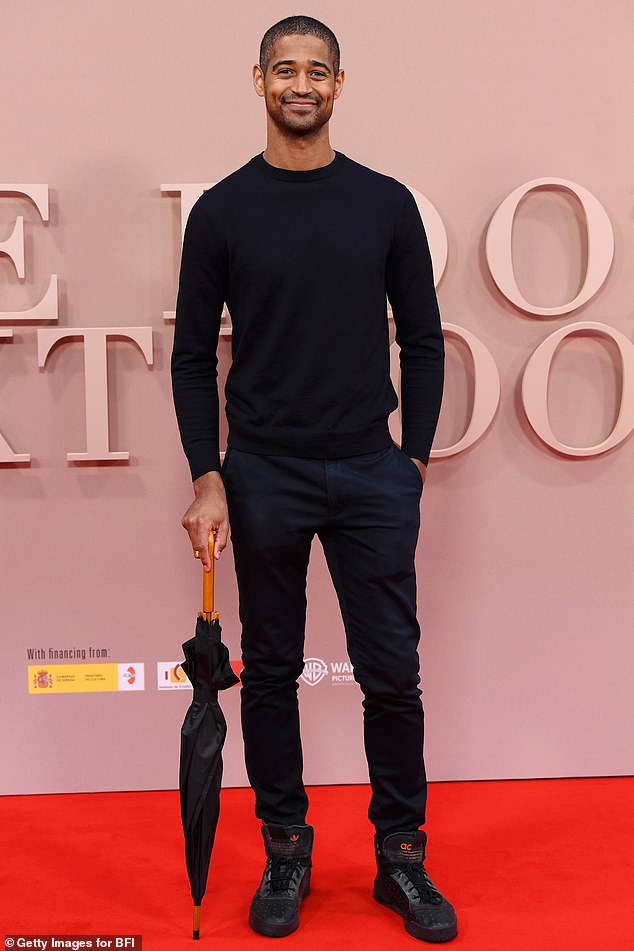 Alfred Enoch looked effortlessly stylish in an all-black ensemble