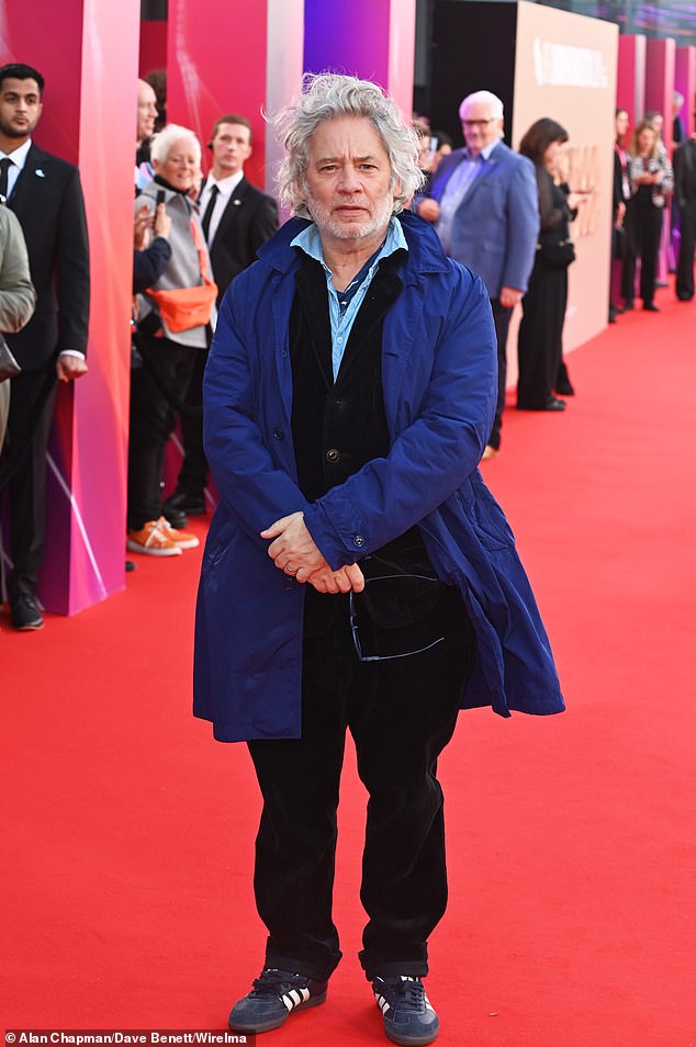 Actor and film director Dexter Fletcher braved the weather in a quilted blue jacket