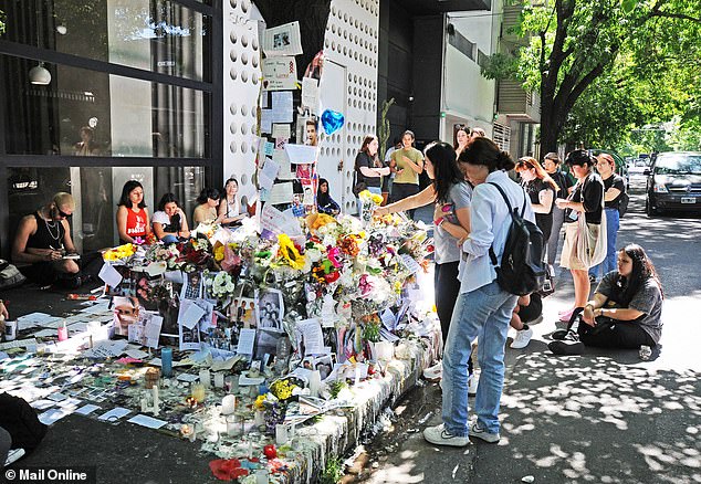 People paying tribute to the CasaSur Palermo Hotel in Buenos Aires on Saturday afternoon