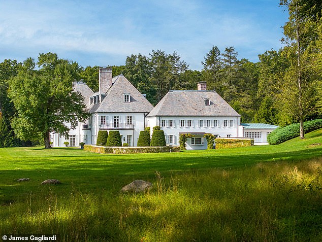 The main residence is spread over approximately 13,000 square feet and the entrance to the property is flanked by two gatehouses: one used as a caretaker's house and the other as a gym.