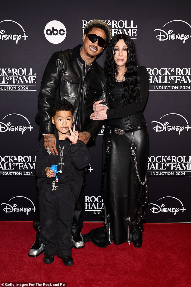 She was joined on the red carpet by her boyfriend, Alexander 'AE' Edwards and his four-year-old son, Slash Electric Alexander Edwards