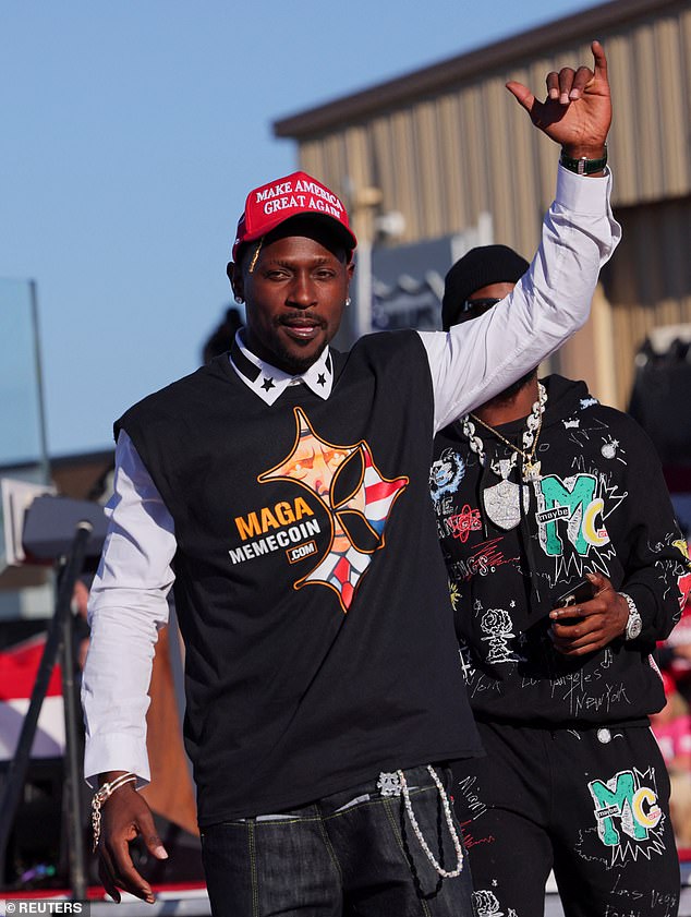 Brown gestures on stage during the rally in Pennsylvania on Saturday afternoon