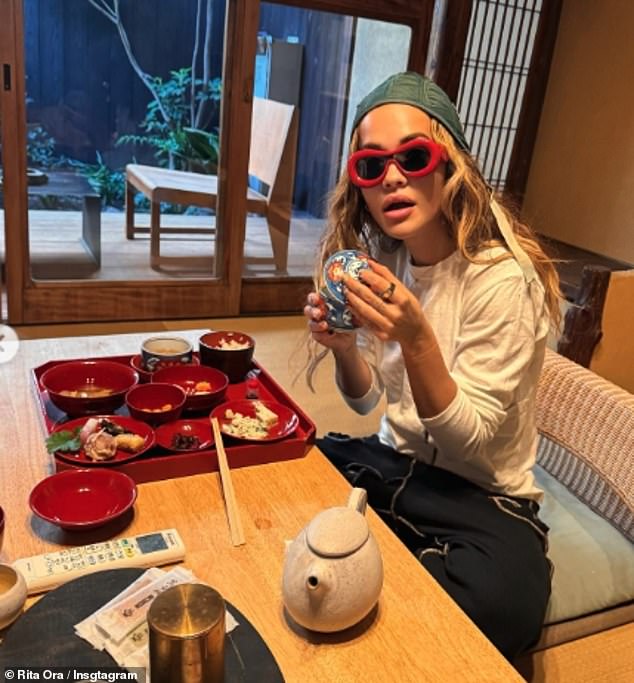 The singer cut a quirky figure as she enjoyed a Japanese meal