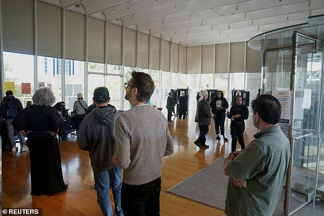 People wait in line to vote in Atlanta Georgia on October 16. More than 1.3 million people have already cast ballots as in-person voting in the state has broken records