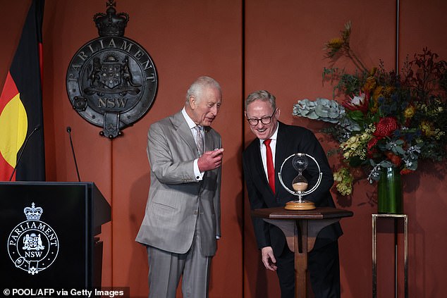 Despite the long journey Down Under, he looked happier, but he also seemed delighted to be presented with an hourglass as a gift for the occasion.