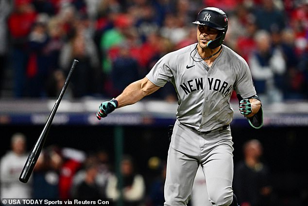 Giancarlo Stanton throws his bat after tying the game with a home run in the sixth inning