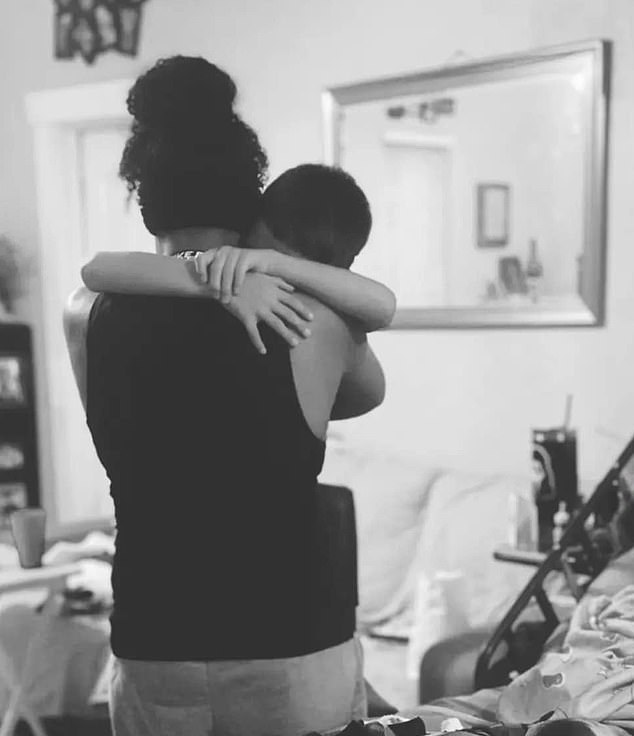 Diarte-Carr's cousin posted a black and white photo of a relative hugging her young son as his mother lay dying in bed next to them