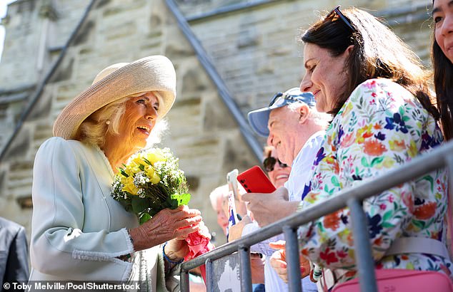 Queen Camilla was presented with gifts as the couple made their way to St. Thomas's Anglican Church