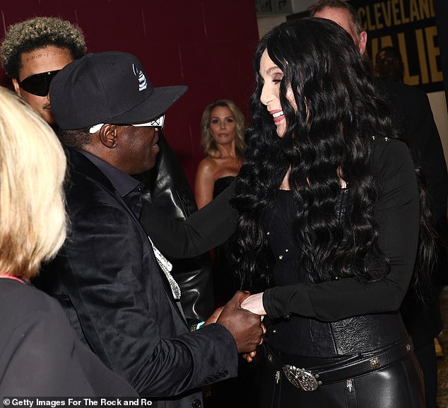 The legendary singer and actress greeted Flavor Flav as friend Alexander looked on