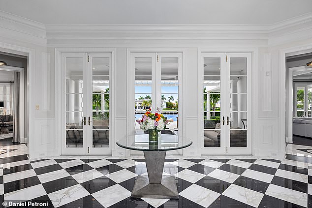 The Miramar Estate features sleek, elegant flooring throughout, including dramatic black and white marble at the entrance that sets the tone for the luxurious design