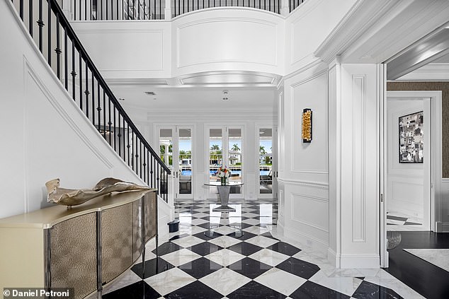 A large spiral staircase serves as the centerpiece of the Miramar Estate and elegantly meanders upwards