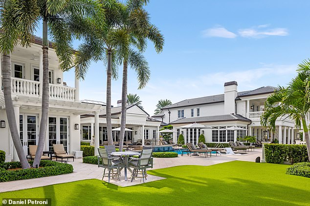 Carefully landscaped lawns provide a lush backdrop for al fresco dining