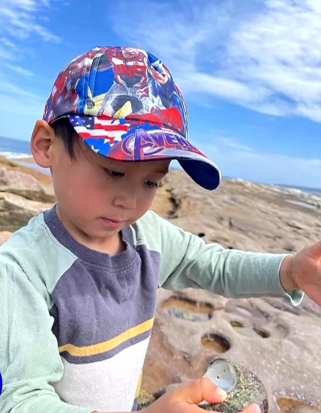 Mitchell Nguyen enjoys a day at the beach as family friends wrote about their shock over the tragedy