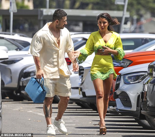 At one point, Jono happily wore the expensive designer item while Nilofar put on her top before heading into chic lunch spot Catalina, located on the Sydney Riviera in Rose Bay.