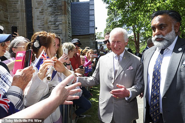 Charles greets the crowd outside after attending a Sunday church service at St. Thomas' Anglican Church