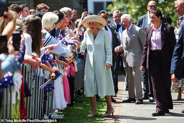 King Charles III and Queen Camilla greet the crowds during a visit to St. Thomas's Anglican Church