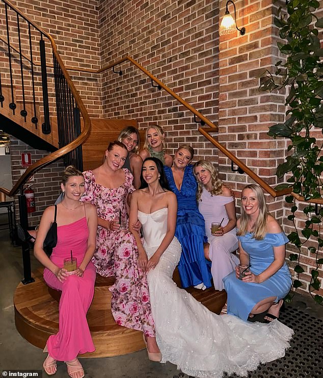 Caitlin, who has built an impressive legal career as a barrister, stuns in a classic silk wedding dress, with a lace-trimmed train studded with sparkling jewels. Pictured center