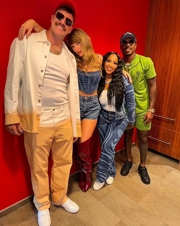 The singer is pictured with boyfriend Travis Kelce, Chariah Gordon and Mecole Hardman (L-R)