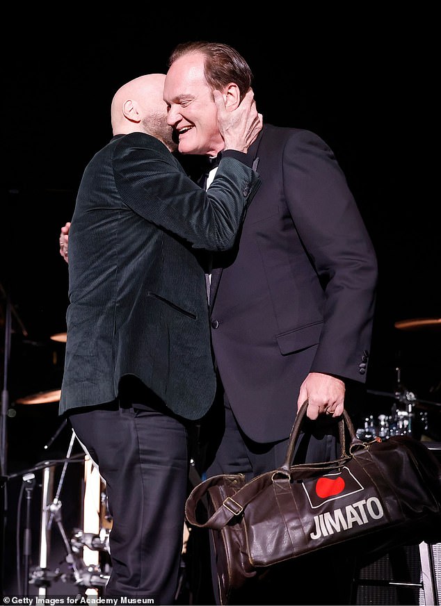 Travolta looked dapper in a black suit jacket paired with a high-neck sweater for the evening, while Tarantino wore a tuxedo.