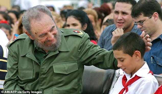 Pictured: Cuban President Fidel Castro caresses Elian Gonzalez's head during a graduation ceremony in Cardenas, July 21, 2005