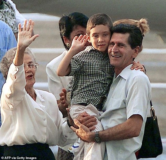 Pictured: Six-year-old Cuban castaway Elian Gonzalez (C) is carried by his grandfather Juan Gonzalez (R) next to his great-grandmother Ramona (L) upon Elian's arrival from the United States on June 28, 2000 at Havana's Jose Marti Airport