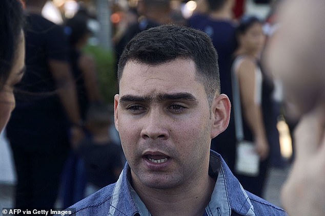 Pictured: Elian Gonzalez talks to the press at Revolution Square in Havana, where people pay their respects to Cuban revolutionary leader Fidel Castro on November 29, 2016