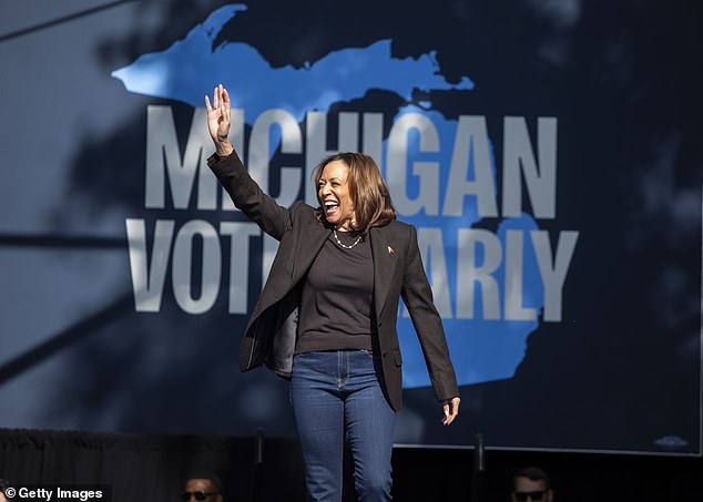 Democratic presidential candidate Vice President Kamala Harris walks on stage to speak at a campaign event on October 18, 2024 in Grand Rapids, Michigan