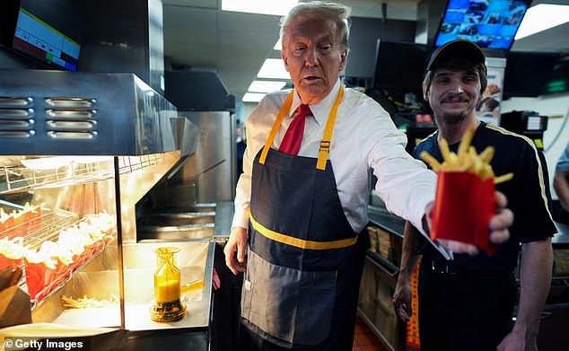 1729452633 381 Donald Trump trolls Kamala Harris by working the McDonalds drive thru