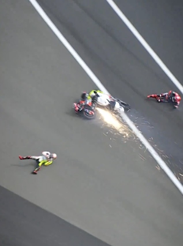 They slid across the asphalt and hit a sandy drop before both riders came to a stop