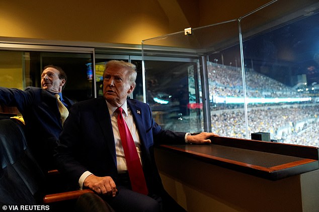 Trump is seen sitting in one of the private suites during the football game in Pittsburgh