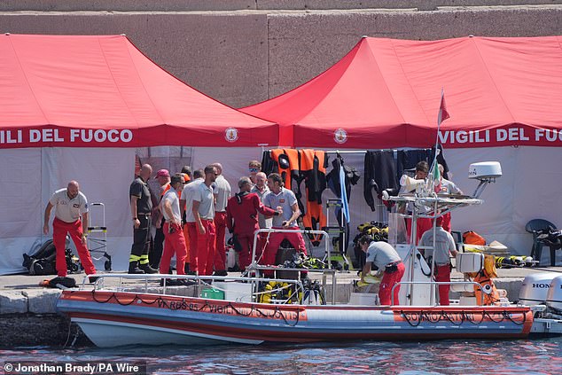 An Italian fire brigade diving team returns to port on the fifth day of the search and salvage operation after the luxury yacht Bayesian sank in a storm