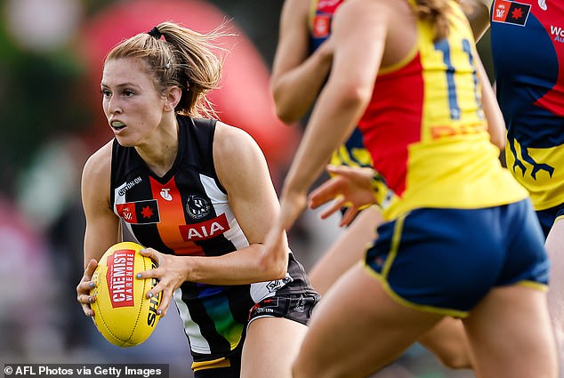 Footy legend Dale Thomas says the new footballs feel exactly the same - except they need to be charged before a match (Photo: A smart ball used in Collingwood's round of 16 tie against Adelaide last weekend)