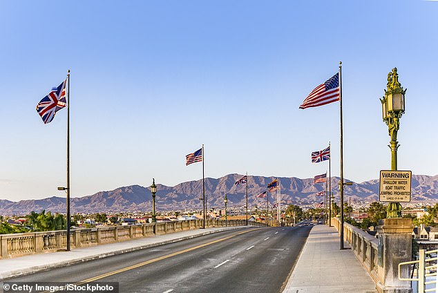 In the photo: The flags of both the United States and Great Britain fly over the bridge today