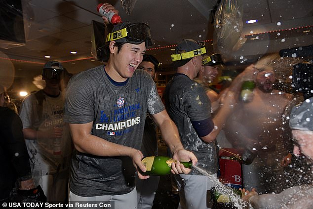 He also returned the favor by popping and spraying some champagne bottles himself