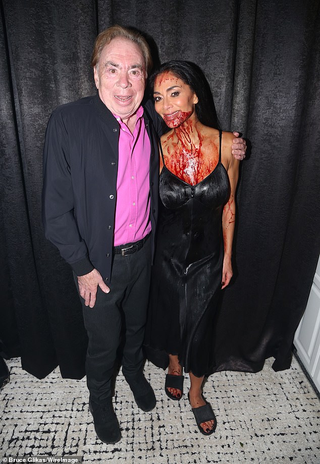 She also came out to pose for photos with composer Andrew Lloyd Webber while covered in fake blood.