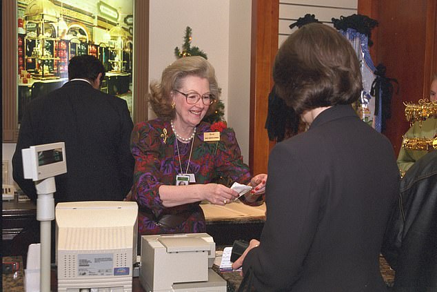 Raine served a customer in the Harrods store at Heathrow in 1997