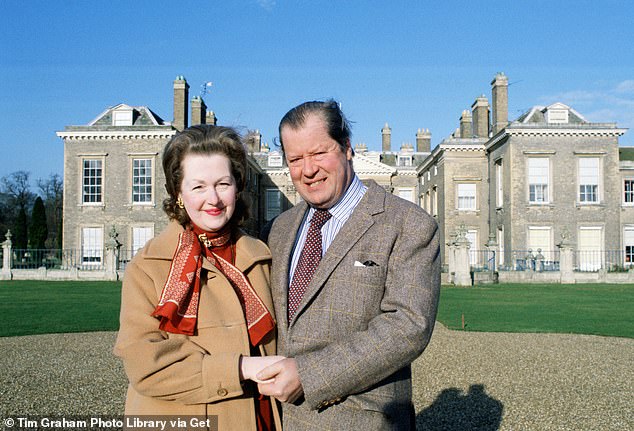 Raine with her second husband, Earl Spencer, standing outside Althorp House in 1981