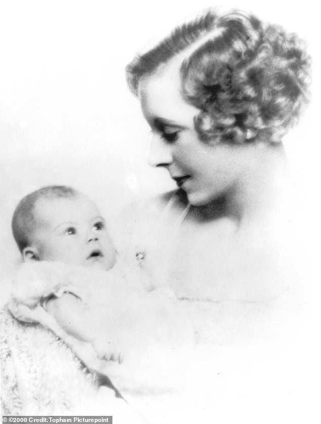 Raine was pictured as a baby being held by her mother Barbara Cartland