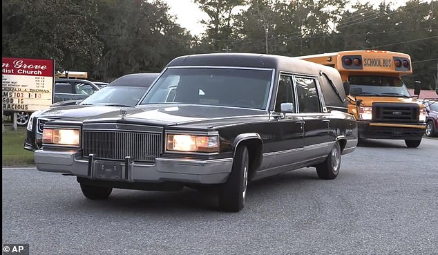 A hearse heads to Meridian Dock in McIntosh County, where seven people were killed after a gangway collapsed, plunging them into the water, on Sapelo Island, Georgia in McIntosh County