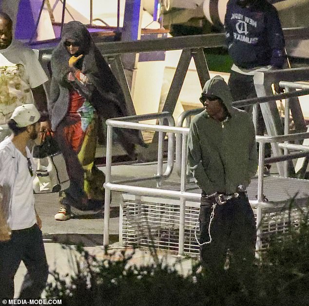 The Sicko Mode hitmaker cut a casual figure in a washed-out khaki zip-up hoodie and baggy jeans. He added a chunky belt to his look, along with a silver watch and bracelet, and opted to hide his famous face behind a pair of designer sunglasses.