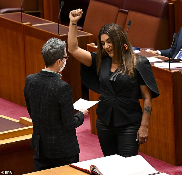 In 2022, Ms Thorpe (right) marched onto the floor of Parliament with a Black Power salute to take her parliamentary oath